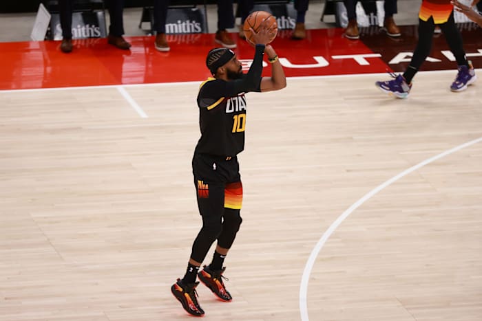 Mike Conley (10) shoots a three pointer in game five against the Memphis Grizzlies